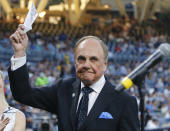 FILE - In this Sept. 29, 2016, file photo, San Diego Padres broadcaster Dick Enberg waves to crowd at a retirement ceremony prior to the Padres' final home baseball game of the season, against the Los Angeles Dodgers in San Diego. Enberg replaced Curt Gowdy as the lead announce for NBC's coverage of the NFL in 1979 and spent more than three decades calling NFL games there and at CBS. Known for his exclamation "Oh my!" that was peppered throughout his broadcasts, Enberg called eight Super Bowls and NBC and was the pregame host for another. (AP Photo/Lenny Ignelzi, File)