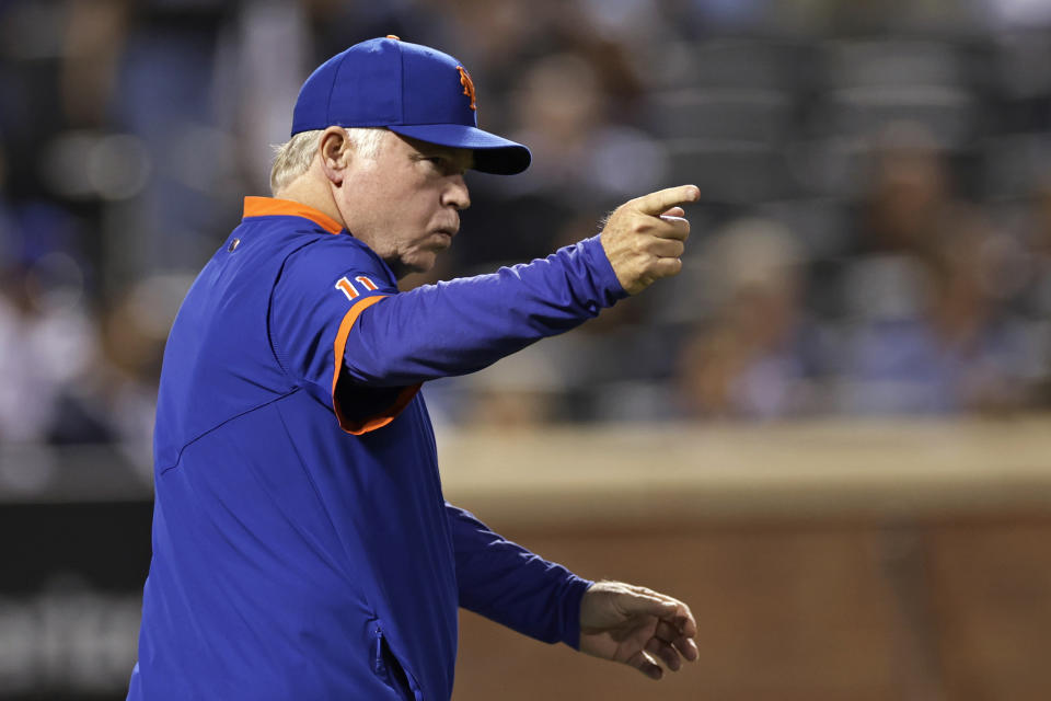 New York Mets manager Buck Showalter signals for a pitching change during the first inning of the team's baseball game against the Chicago Cubs on Wednesday, Sept. 14, 2022, in New York. (AP Photo/Adam Hunger)