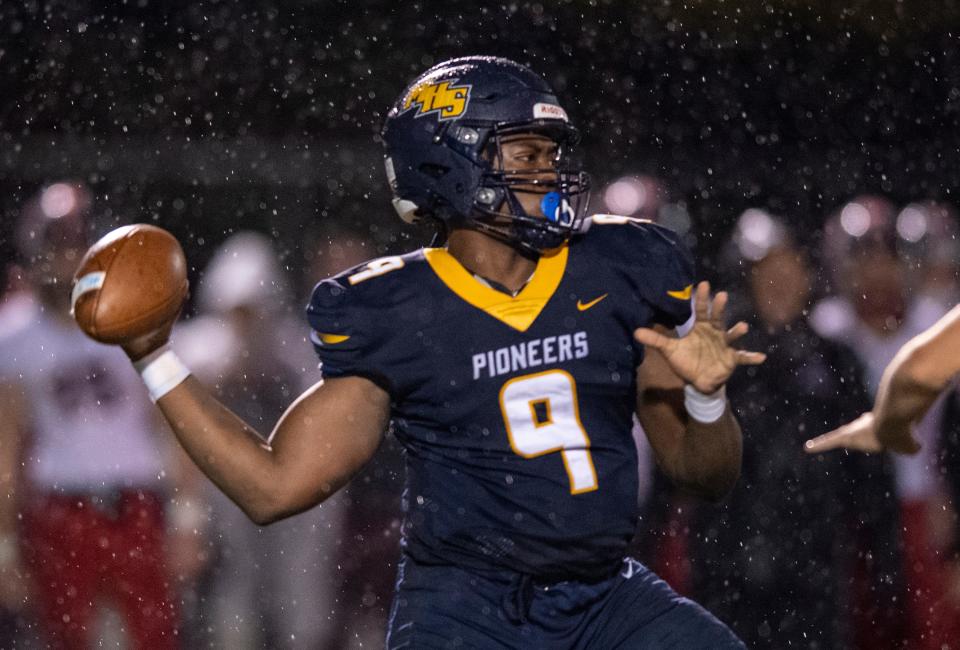 Mooresville High School junior Nicholas Patterson (9) drops back to pass during the first half of an IHSAA class 4A sectional football game against East Central High School, Friday, Oct. 29, 2021, at Mooresville High School.