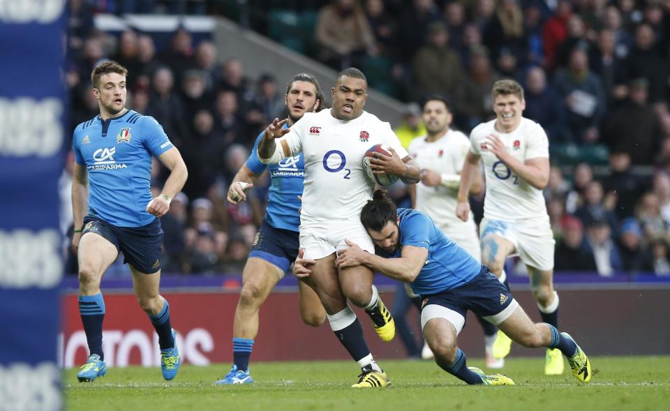 England's Kyle Sinckler goes on the charge during the Six Nations rugby union match between England and Italy at Twickenham stadium in London, Sunday, Feb. 26, 2017. (AP Photo/Alastair Grant)