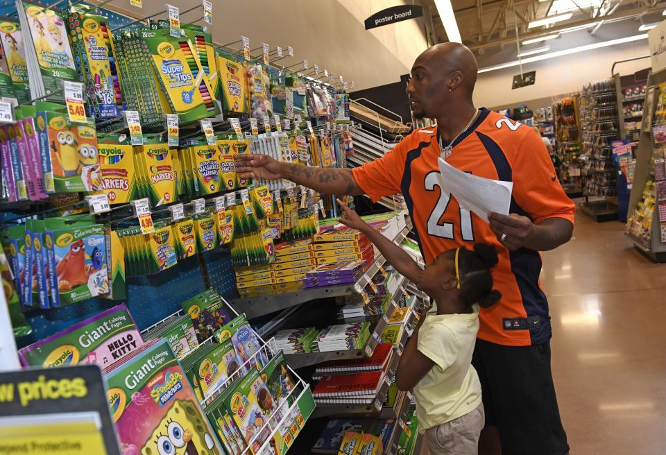 <p>Denver Broncos cornerback Aqib Talib, #21, shops with Jayda McIntosh, 6 at King Soopers Marketplace on July 25, 2016 in Parker, Colorado. Denver Broncos players and cheerleaders shopped with kids from the Denver Broncos Boys & Girls Club for it’s inaugural Back to School event. </p>