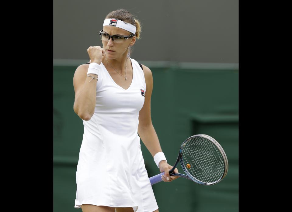 Yaroslava Shvedova of Kazakhstan reacts during a fourth round singles match against Serena Williams of the United States at the All England Lawn Tennis Championships at Wimbledon, England, Monday, July 2, 2012.