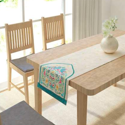 The cotton, embroidered <a href="https://fave.co/37xEScb" rel="noopener" target="_blank" data-ylk="slk:Peacock table runner by IVY;elm:context_link;itc:0;sec:content-canvas" class="link "><strong>Peacock table runner by IVY</strong></a>. Size: 13 X 72 inches. <em>Rs.999.</em> <a href="https://fave.co/37xEScb" rel="noopener" target="_blank" data-ylk="slk:Buy here!;elm:context_link;itc:0;sec:content-canvas" class="link "><strong>Buy here!</strong></a>