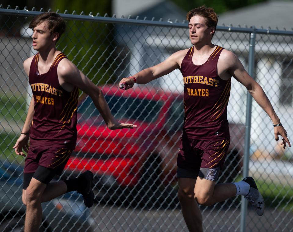 Portage Trail Conference Championship Finals held at Mogadore High School. 4x200 Relay, Southeast, Ty Sprutte hands off to Gavin Berka.