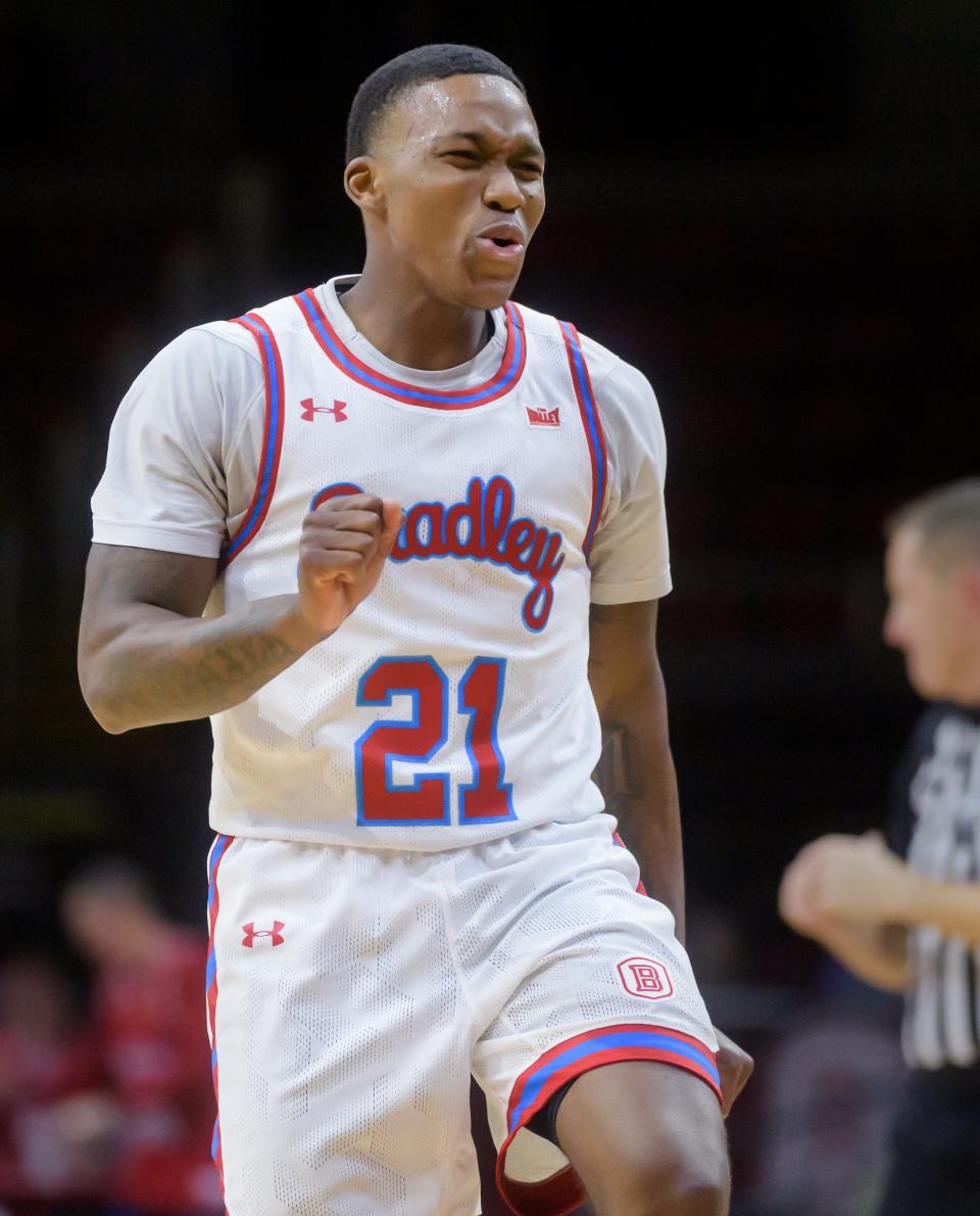 Bradley's Duke Deen celebrates one of his three-pointer against Akron in the second half Thursday, Dec. 22, 2022 at Carver Arena. The Braves crushed the Zips 74-55.