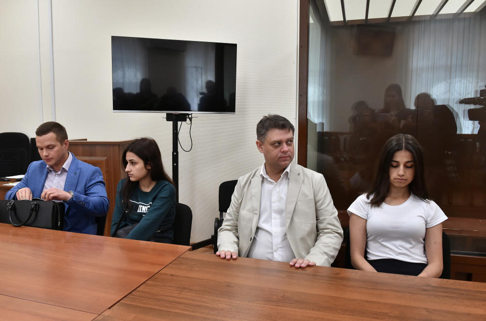 Angelina (R) and Maria (2nd-L) Khachaturyan, two of three Khachaturyan sisters, who accused of killing their father, attend the court hearing in Moscow, Russia June 26, 2019. Picture taken June 26, 2019. REUTERS/Kommersant Photo/Dmitry Lebedev RUSSIA OUT. NO COMMERCIAL OR EDITORIAL SALES IN RUSSIA