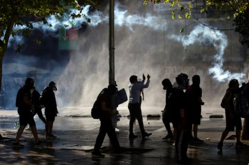 Police used water cannon and tear gas to disperse demonstrators in Chile's capital Santiago