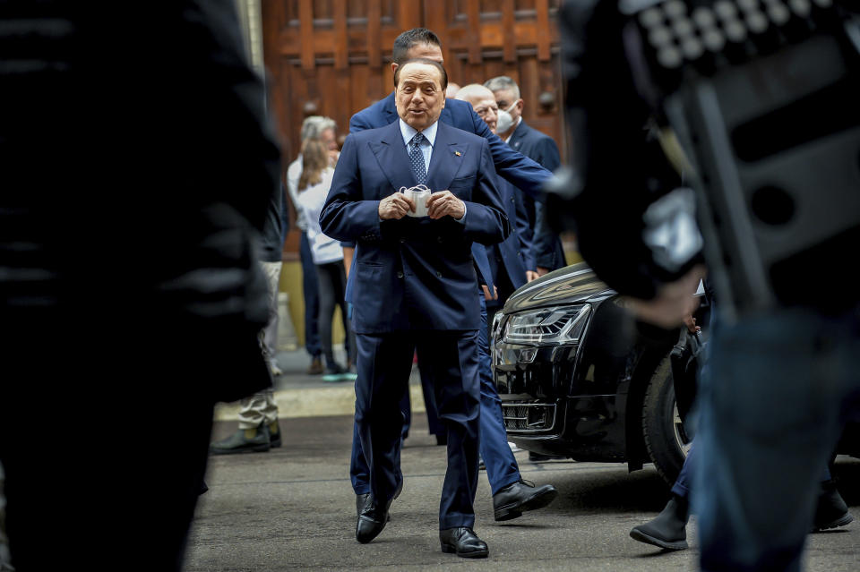 Forza Italia leader Silvio Berlusconi arrives at polling station in Milan, Italy, Sunday, Oct. 3, 2021. Millions of people in Italy started voting Sunday for new mayors, including in Rome and Milan, in an election widely seen as a test of political alliances before nationwide balloting just over a year away. (Claudio Furlan/LaPresse via AP)