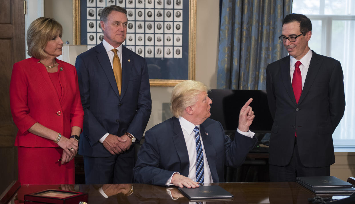 Rep. Claudia Tenney with Sen. David Perdue (R-Ga.), President Donald Trump and&nbsp;Treasury Secretary Steven Mnuchin on April 21, 2017. (Photo: JIM WATSON via Getty Images)