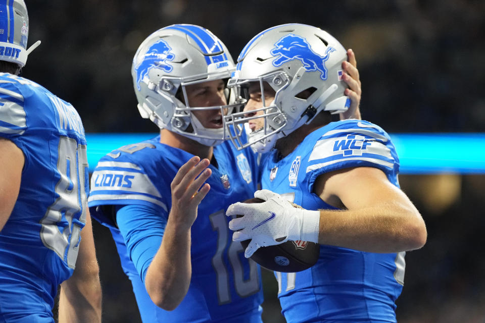 Jared Goff #16 and Sam LaPorta #87 of the Detroit Lions 