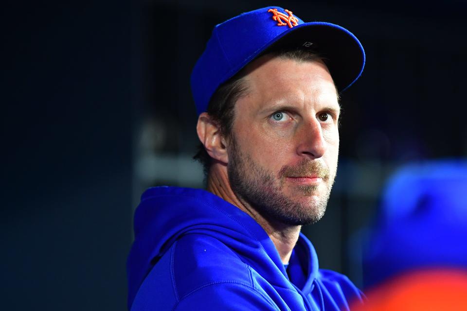 Apr 17, 2023; Los Angeles, California, USA; New York Mets starting pitcher Max Scherzer (21) watches game action against the Los Angeles Dodgers during the ninth inning at Dodger Stadium. Mandatory Credit: Gary A. Vasquez-USA TODAY Sports