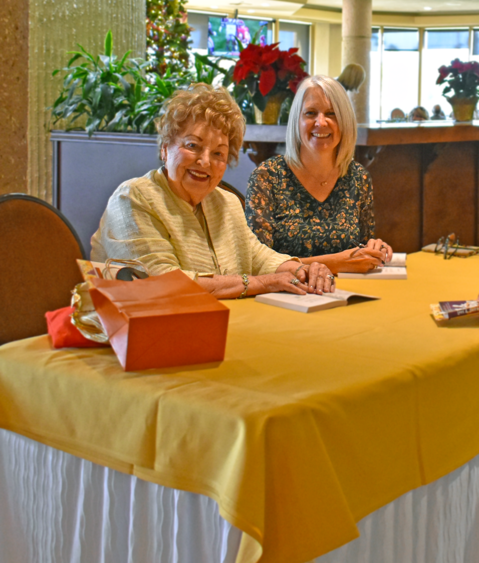 Laura Lee Marcarian and Kim Fay sign books at the Friends of the College of the Desert Library’s 54th annual author luncheon on Dec. 2, 2023.