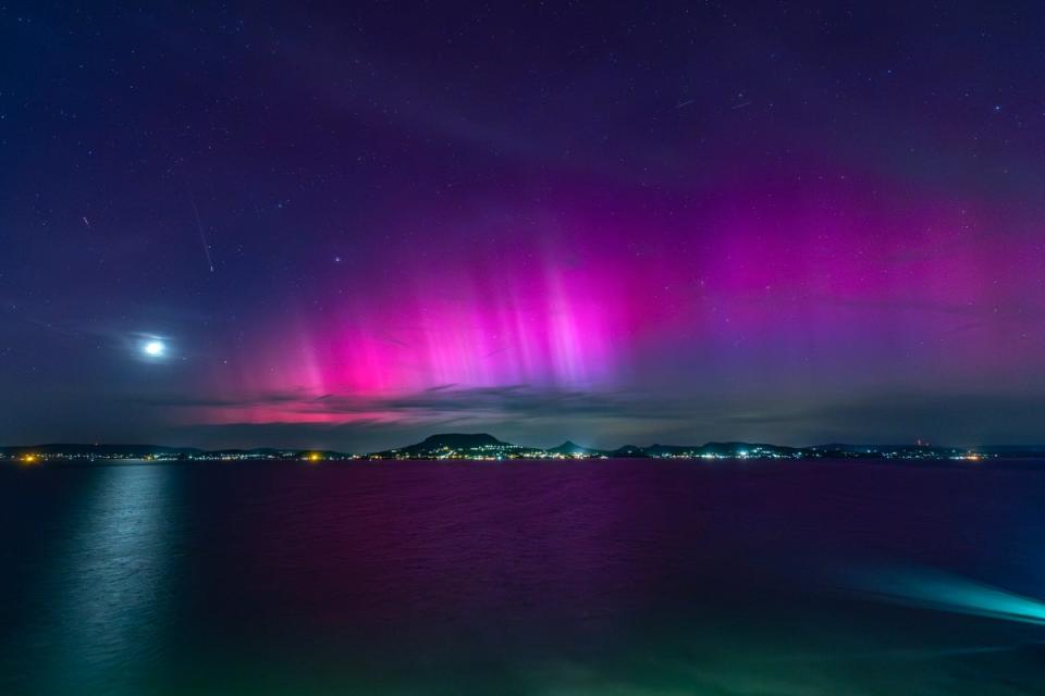 The Northern Lights illuminate the night sky over Lake Balaton near Fonyod, Hungary (EPA)