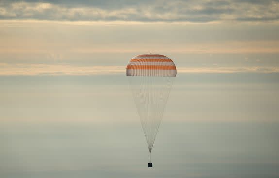 The Soyuz descending to the ground above Kazakhstan.