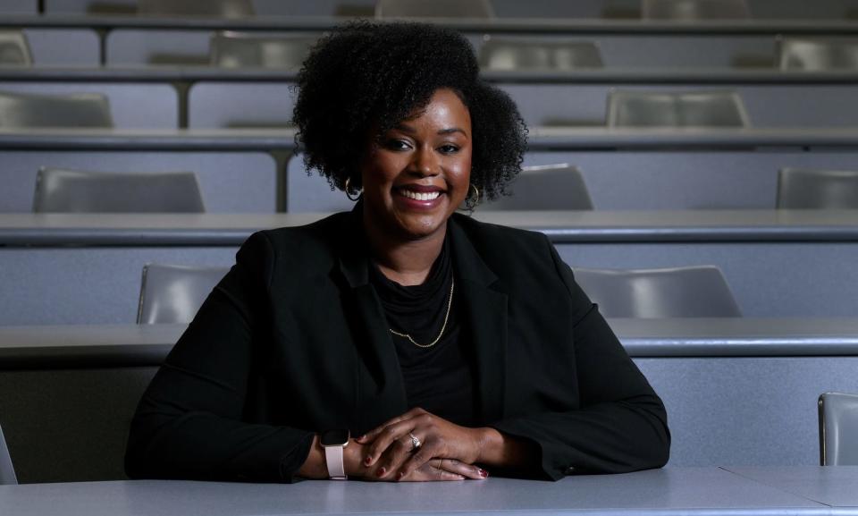 First-year law student Ruth Dimanche in a mock courtroom gallery at the Roger Williams University School of Law.