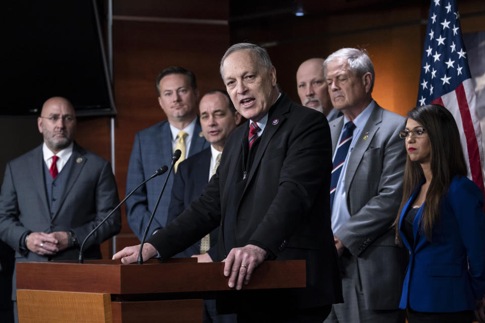 FILE - Rep. Andy Biggs, R-Ariz., center, speaks as members of the House Freedom Caucus hold a news conference at the Capitol in Washington, Friday, March 10, 2023. The banishment of transgender lawmaker Zooey Zephyr from Montana's House floor has showcased the rising power of hardline conservatives who are leveraging divisive social issues to gain political influence. From left are Rep. Clay Higgins, R-La., Rep. Michael Cloud, R-Fla., Rep. Bob Good, R-Va., Rep. Andy Biggs, R-Ariz., Rep. Chip Roy, R-Texas, Rep. Ralph Norman, R-S.C., and Rep. Lauren Boebert, R-Colo. (AP Photo/J. Scott Applewhite, File)