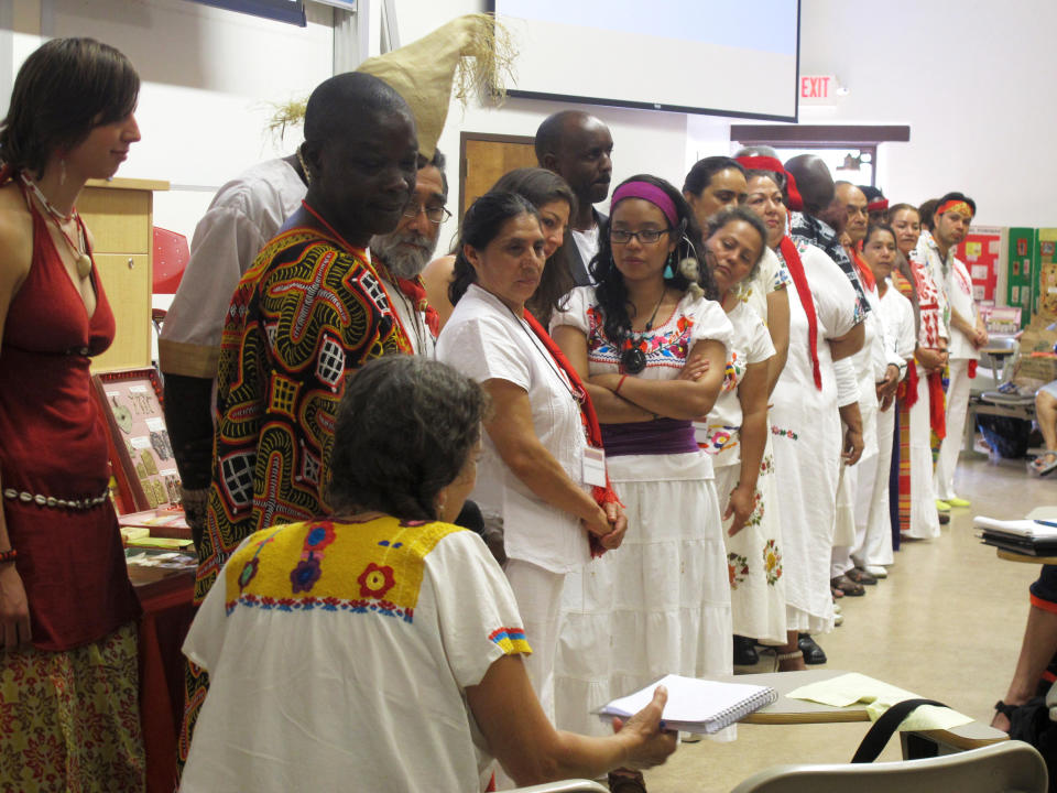 FILE - This July 22, 2013, file photo shows curanderos, or traditional healers, at the University of New Mexico in Albuquerque during a workshop that attracted more than 200 traditional healers from across the country and Latin America. "The Curse of La Llorona" promotion using traditional Mexican healers for "spiritual cleansings" before screenings is drawing strong criticism from healers and scholars. Critics say the movie released Friday, April 19, 2019, is based on a Mexican folktale that has nothing to do with healers known as curanderos and the promotion exploits traditional healing practices used by Mexicans and Mexican Americans just to sell a film. (AP Photo/Russell Contreras, File)