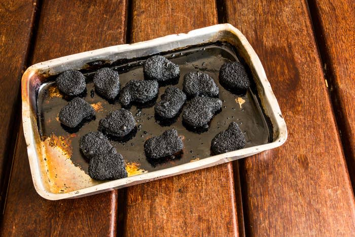 A tray of burnt chicken nuggets