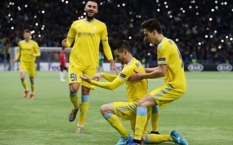 Astana celebrate going 2-1 up against Man Utd - Credit: Reuters