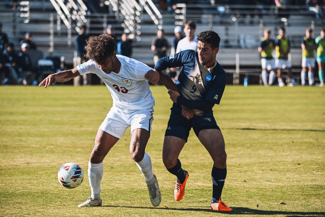 FIU men’s soccer forward Eduardo Mustre (right) battles Virginia’s Austin Rome during this past weekend’s second round match in the NCAA tournament. The Panthers lost 2-1 in overtime.