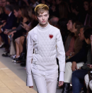 <p>A long line of fencing-inspired suits took to the runway with tied white jackets and knee-length trousers offering women the chance to dress strong and masculine. Heart embroidery over the chest gave a cheeky womanly detail while Ruth Bell’s tomboy cut worked as the perfect accessory.</p><p><i>[Photo: Instagram/dior]</i></p>