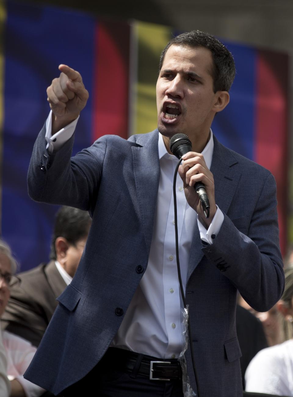 Juan Guaido, President of the Venezuelan National Assembly delivers a speech during a public session with opposition members, at a street in Caracas, Venezuela, Friday, Jan. 11, 2019. The head of Venezuela's opposition-run congress says that with the nation's backing he's ready to take on Nicolas Maduro's presidential powers and call new elections.(AP Photo/Fernando Llano)