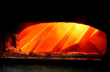 FILE PHOTO: Spoilt aluminium ingots are seen in a melting furnace at the foundry shop of the Rusal Krasnoyarsk aluminium smelter in Krasnoyarsk, Siberia, July 27, 2016. Picture taken July 27, 2016. REUTERS/Ilya Naymushin/File Photo