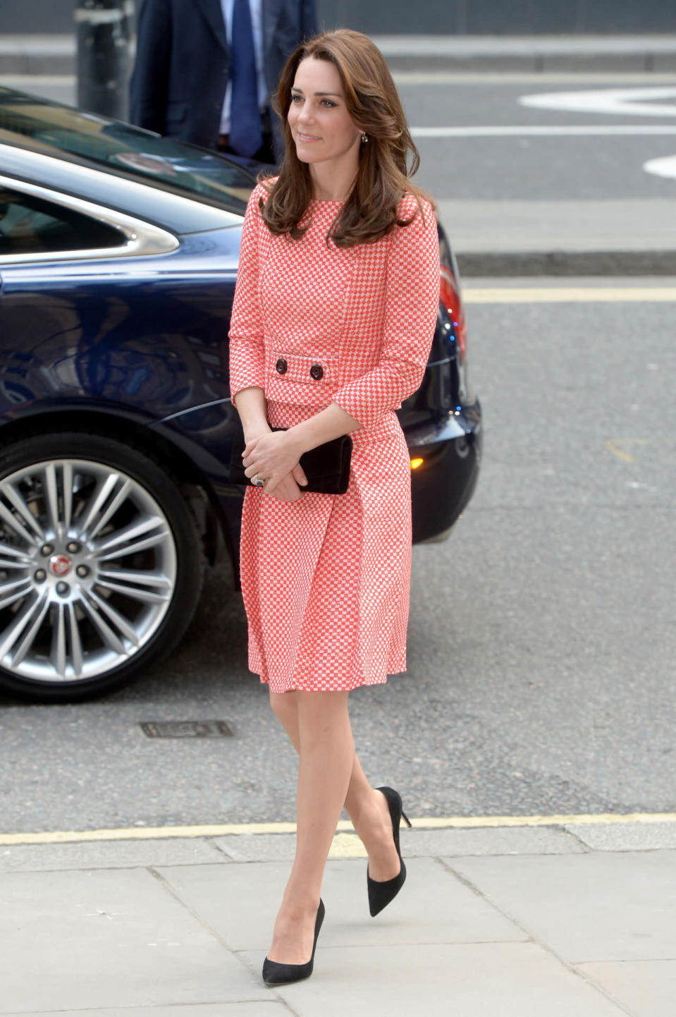 <p>While visiting a youth project in London, Kate donned a red-and-white gingham suit by Eponine London. She paired the outfit with black Gianvito Rossi pumps and a Stuart Weitzman bag. </p><p><i>[Photo: PA]</i></p>