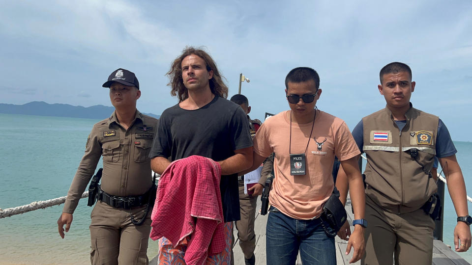 Daniel Sancho Bronchalo, the son of Spanish actor Rodolfo Sancho Aguirre, is escorted as he assists Thai police with investigations after he was arrested on charges of murder in the death and mutilation of his Colombian travel companion Edwin Arrieta Arteaga on the tourist island of Koh Phangan, Thailand on August 7, 2023. / Credit: STRINGER / REUTERS