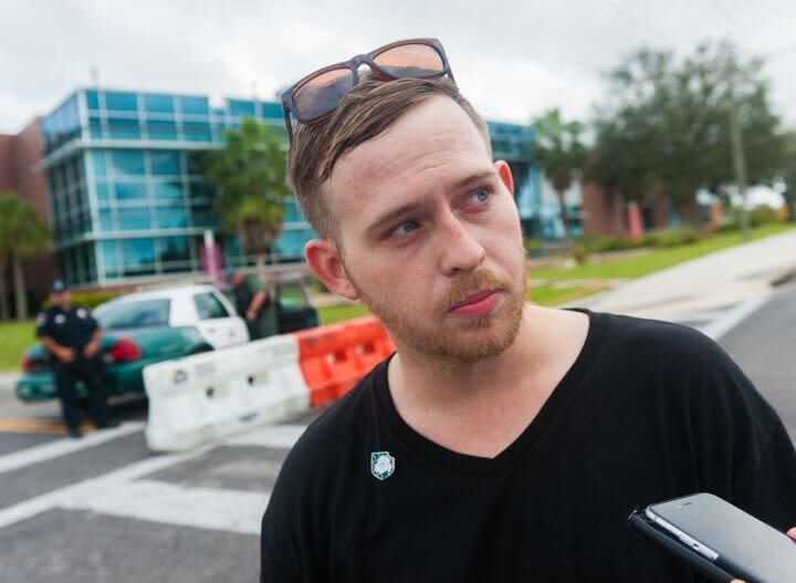 Talking to Colton Fears, who's wearing a Nazi pin, outside an event at the University of Florida, where white supremacist Richard Spencer was set to speak.  (Photo: Chris McGonigal/HuffPost)