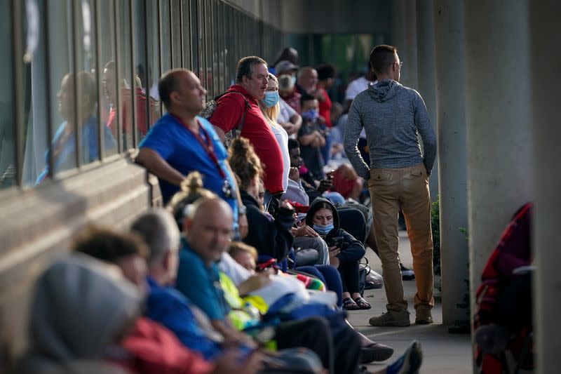 FILE PHOTO: People wait outside Kentucky Career Center in Frankfort