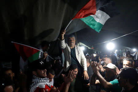 People celebrate after Israel delays eviction of the Palestinian Bedouin village of Khan al-Ahmar, in the occupied West Bank October 20, 2018. REUTERS/Mohamad Torokman