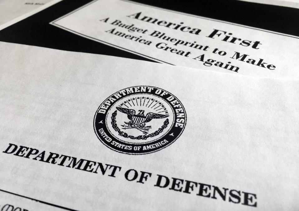 A portion of President Donald Trump's first proposed budget, focusing on the Department of Defense, and released by the Office of Management and Budget, is photographed in Washington, Wednesday, March 15, 2017. President Donald Trump is unveiling a $1.15 trillion budget, a far-reaching overhaul of federal government spending that slashes a dozen departments to finance a significant increase in the military and make a down payment on a U.S.-Mexico border wall. (AP Photo/Jon Elswick)