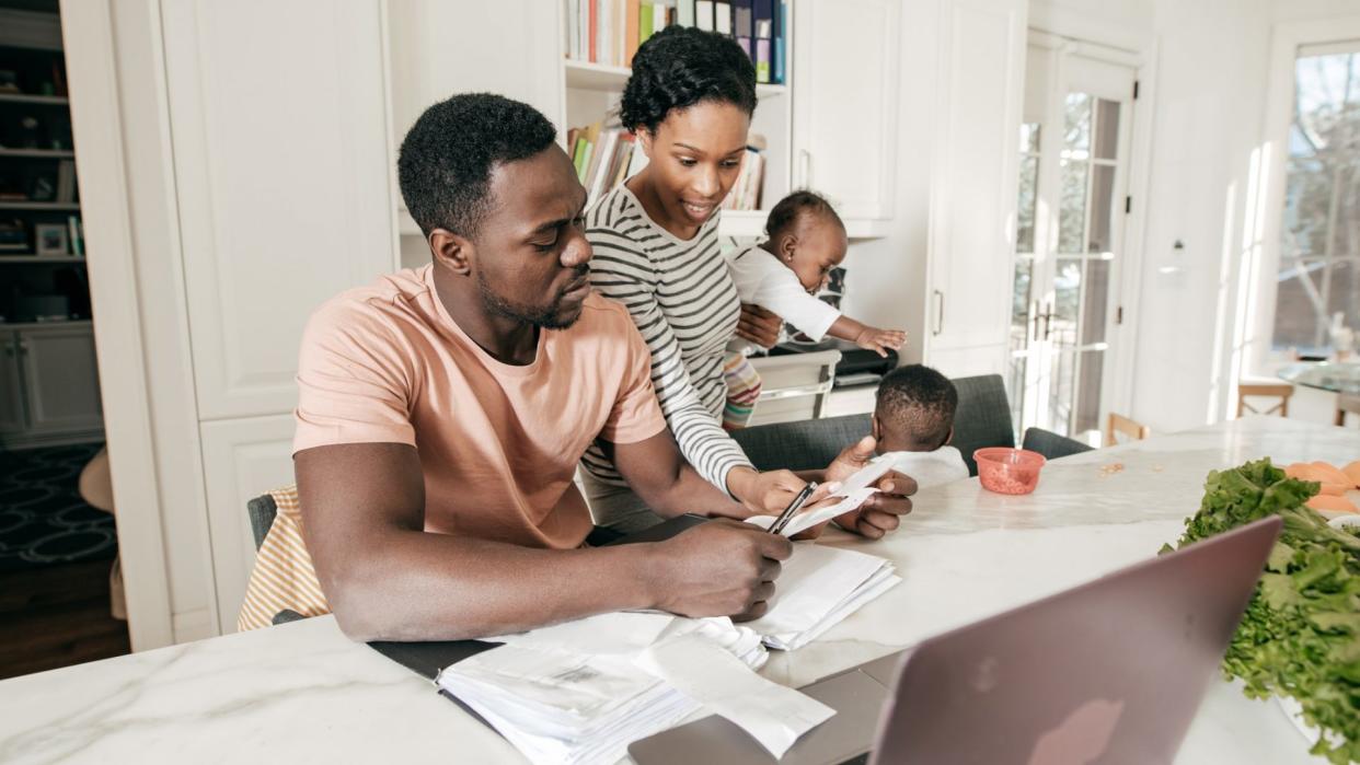 A couple is doing accounting at home.