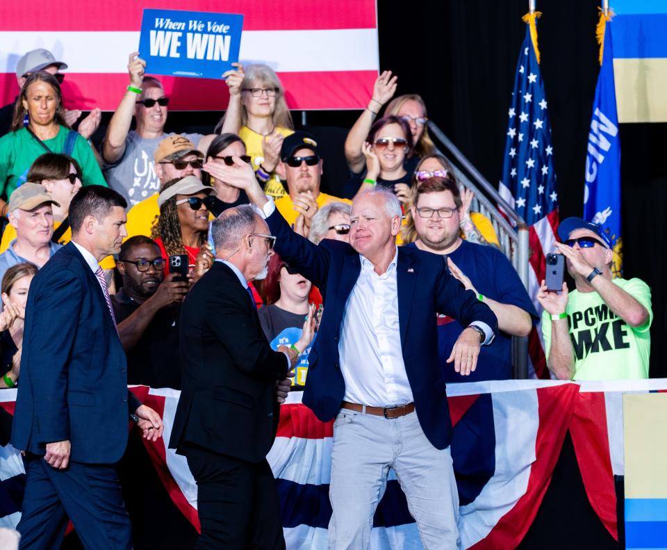 Democratic Vice Presidential nominee Minnesota Gov. Tim Walz waves at the crowd at Laborfest 2024 hosted by labor unions and union members of the Milwaukee Area Labor Council on Monday September 2, 2024 at the Henry Maier Festival Park in Milwaukee, Wis.