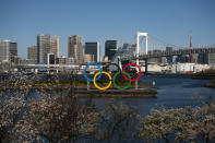A barge carrying the Olympic rings floats in the water Wednesday, March 25, 2020, in the Odaiba section of Tokyo. Not even the Summer Olympics could withstand the force of the coronavirus. After weeks of hedging, the IOC took the unprecedented step of postponing the world's biggest sporting event, a global extravaganza that's been cemented into the calendar for more than a century. (AP Photo/Jae C. Hong)