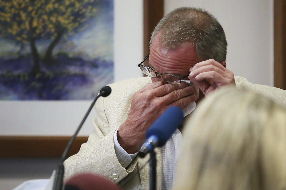 FILE - Neil Heslin, father of 6-year-old Sandy Hook shooting victim Jesse Lewis, becomes emotional during his testimony during the trial for Alex Jones, Aug. 2, 2022, at the Travis County Courthouse in Austin. A federal bankruptcy judge on Thursday, June 27, 2024, stopped an effort by Heslin and Scarlett Lewis to collect on some of the $50 million owed to them by conspiracy theorist Alex Jones and his company for his claims that the massacre was a hoax. (Briana Sanchez/Austin American-Statesman via AP, Pool, File)