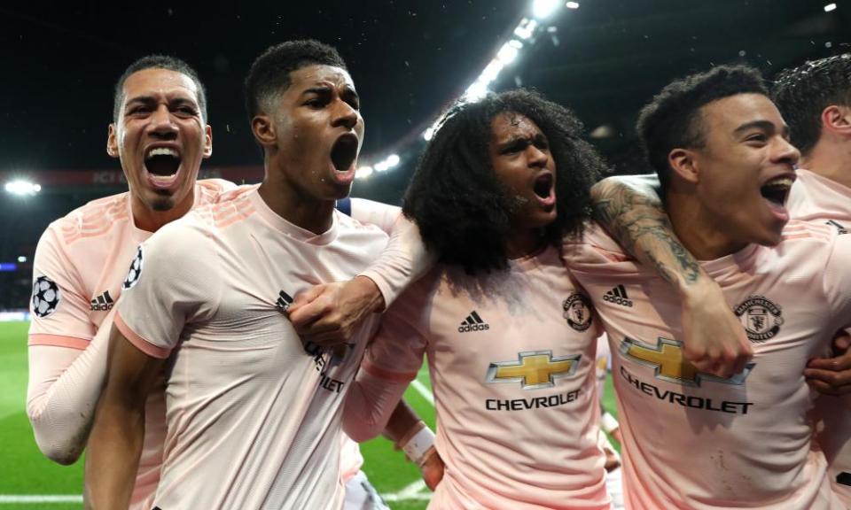 Marcus Rashford (second left) celebrates with (from left) Chris Smalling, Tahith Chong and Mason Greenwood after the late penalty that eliminated PSG.