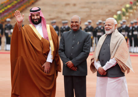 Saudi Arabia's Crown Prince Mohammed bin Salman waves next to India's President Ram Nath Kovind and Prime Minister Narendra Modi during his ceremonial reception at the forecourt of Rashtrapati Bhavan in New Delhi, India, February 20, 2019. REUTERS/Adnan Abidi