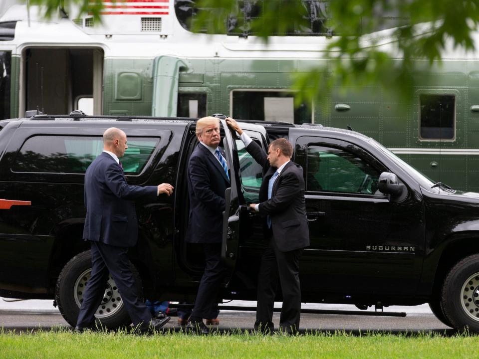 Donald Trump gets into a presidential SUV