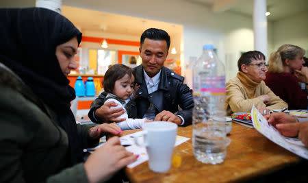 Afghan migrant Ali Mohammad Rezaie attends the Sprachcaffe (language cafe) organised by the neighbourhood association Kiezspinne in Berlin, Germany, October 01, 2018. REUTERS/Hannibal Hanschke