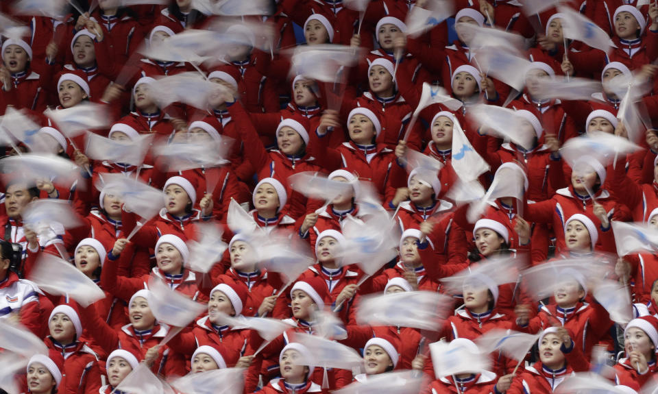 FILE - North Korean cheerleaders sing during the men's 500 meters short track speedskating semifinal in the Gangneung Ice Arena at the 2018 Winter Olympics in Gangneung, South Korea, on Feb. 22, 2018. North Korea basked in the global limelight during the last Winter Games in South Korea, with hundreds of athletes, cheerleaders and officials pushing hard to woo their South Korean and U.S. rivals in a now-stalled bid for diplomacy. Four years later, as the 2022 Winter Olympics come to its main ally and neighbor China, North Korea isn't sending any athletes and officials because of coronavirus fears. (AP Photo/David J. Phillip, File)