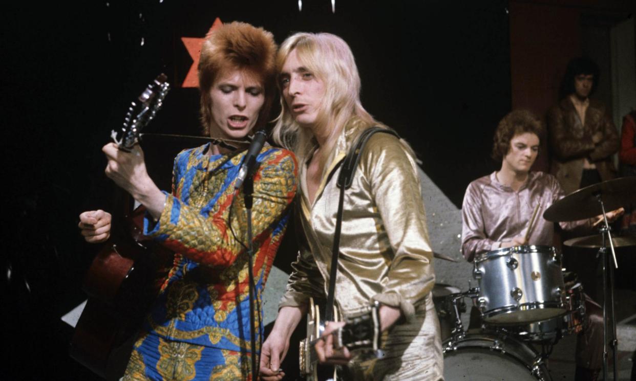 <span>Ziggy pop: David Bowie, Mick Ronson and Mick ‘Woody’ Woodmansey of the Spiders from Mars perform on ITV’s Lift Off With Ayshea show in 1972.</span><span>Photograph: ITV/Rex Features</span>