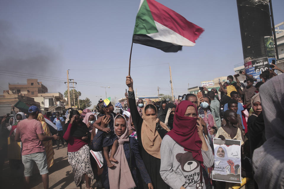 People protests against the October military coup and subsequent deal that reinstated Prime Minister Abdalla Hamdok in Khartoum, Sudan, Monday, Dec. 13, 2021. (AP Photo/Marwan Ali)