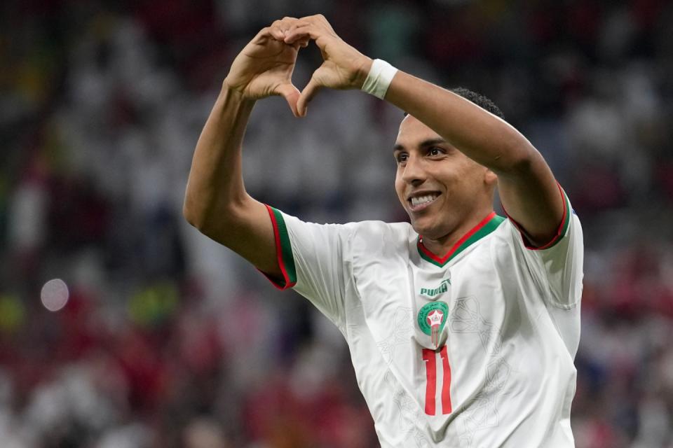 Morocco's Abdelhamid Sabiri celebrates after scoring his side's opening goal during the World Cup group F football match between Belgium and Morocco, at the Al Thumama Stadium in Doha, Qatar, Sunday, Nov. 27, 2022. (AP Photo/Christophe Ena)