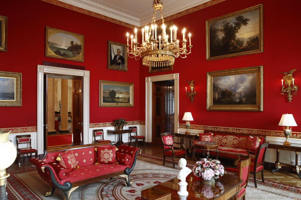 FILE - Refreshed wall fabric in the Red Room of the White House in Washington, on Sept. 17, 2019. A White House tour is practically a must-do in Washington, though the experience can leave some guests asking questions about spaces they don’t get to see, like the Oval Office. The White House Historical Association has a plan to answer those questions when it opens “The People’s House: A White House Experience,” in the fall of 2024. (AP Photo/Patrick Semansky, File)