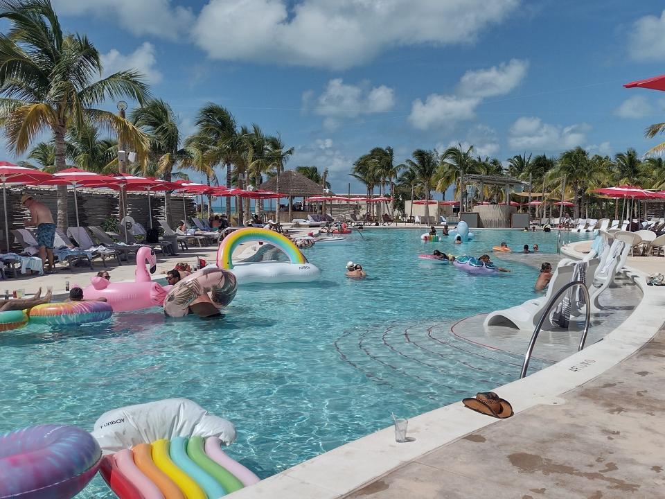 Shot of a pool with multiple floaties in it at the Bimini Beach Club