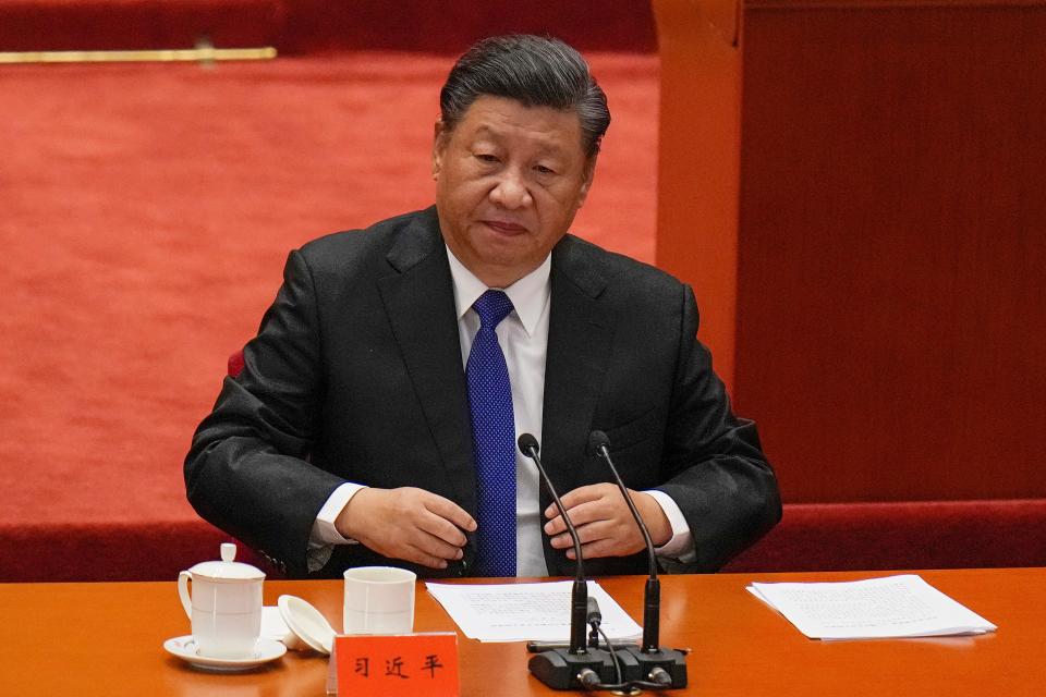 Chinese President Xi Jinping attends an event commemorating the 110th anniversary of Xinhai Revolution at the Great Hall of the People in Beijing, Oct. 9, 2021. Xi said reunification with Taiwan must happen and will happen peacefully, despite a ratcheting-up of China's threats to attack the island.