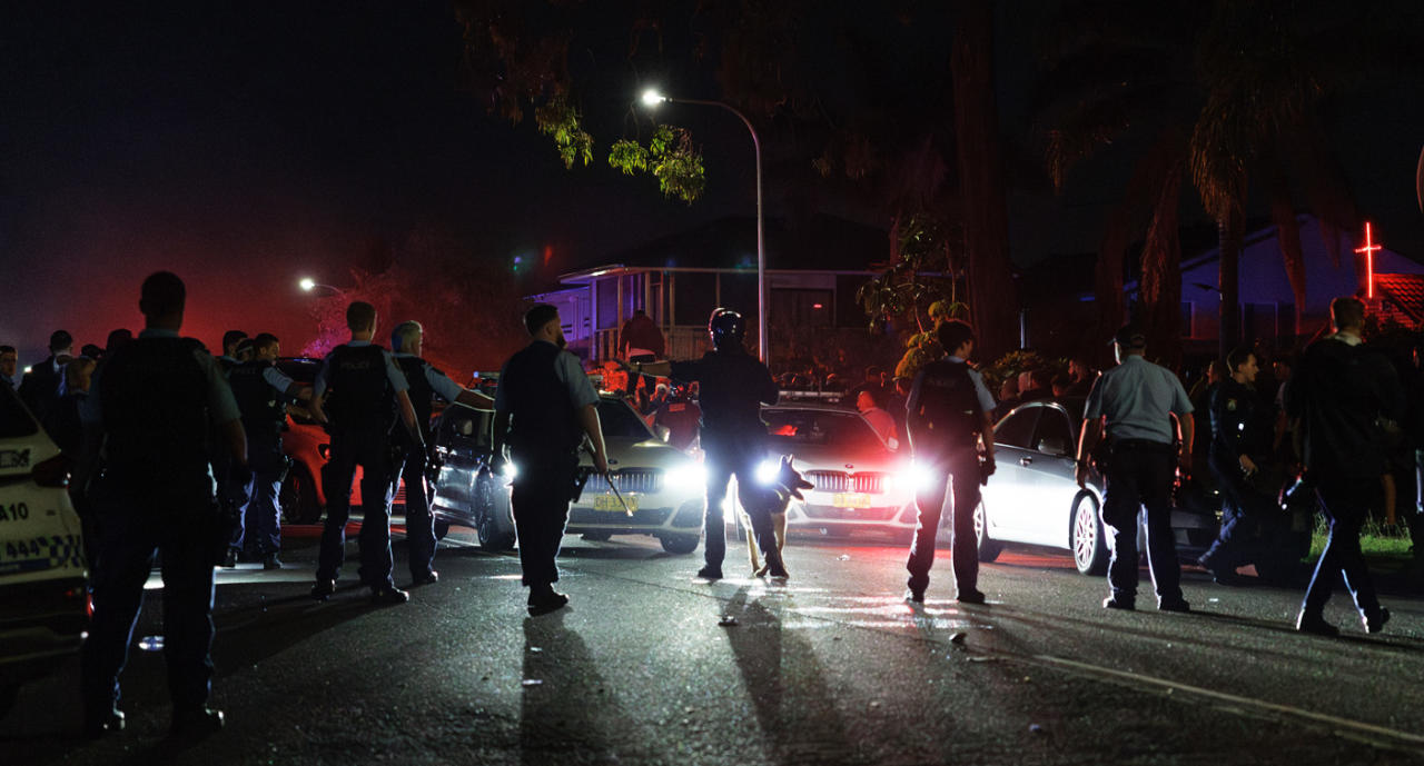 Police in a tense stand-off with community members on Monday night. Source: AAP