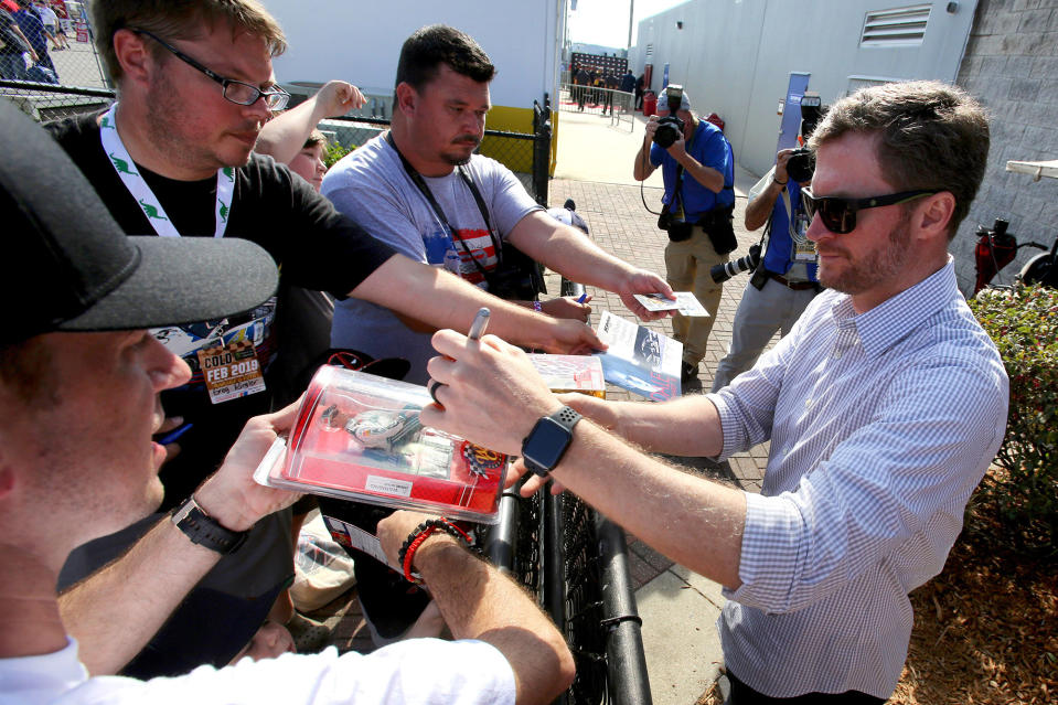 Dale Earnhardt, Jr. signs autograph during the Daytona 500, at Daytona International Speedway, Sunday, February 17, 2019. (Joe Burbank/Orlando Sentinel/Tribune News Service via Getty Images)